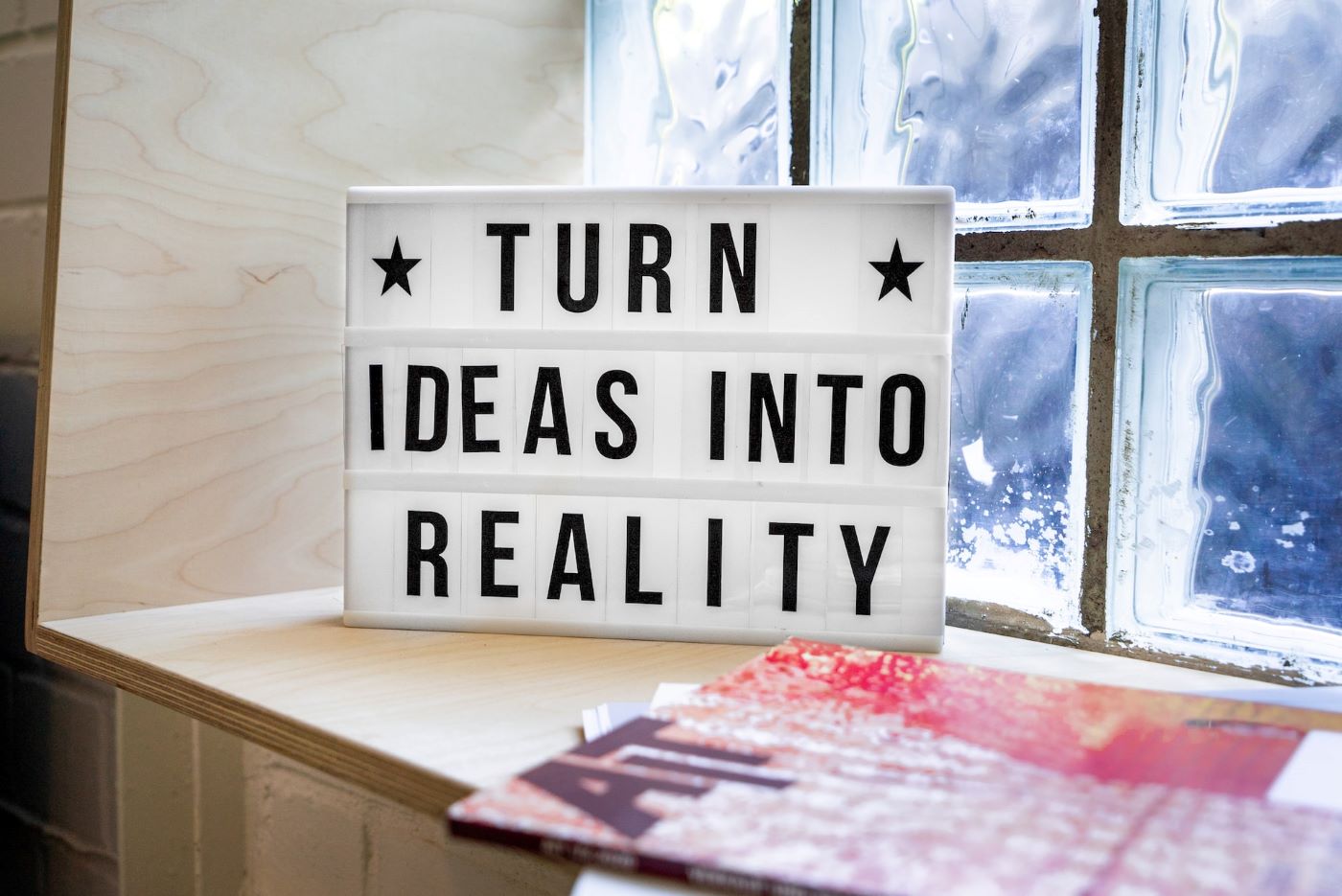 A sign with the words turn ideas into reality
